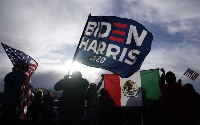 Supporters of US President-elect Joe Biden and Vice President-elect Kamala Harris wave flags in Las Vegas, Nov. 7, 2020 (AP Photo/Jae C. Hong) Supporters of US President-elect Joe Biden and Vice President-elect Kamala Harris wave flags in Las Vegas, Nov. 7, 2020 (AP Photo/Jae C. Hong)
