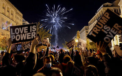 People shoot off fireworks in Black Lives Matter Plaza while celebrating president-elect Joe Biden's win over President Donald Trump to become the 46th president of the United States, Saturday, Nov. 7, 2020, in Washington. (AP/Jacquelyn Martin)