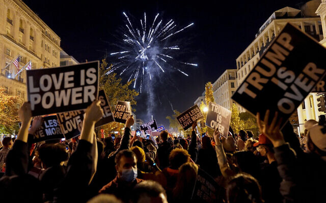 People shoot off fireworks in Black Lives Matter Plaza while celebrating president-elect Joe Biden's win over President Donald Trump to become the 46th president of the United States, Saturday, Nov. 7, 2020, in Washington. (AP/Jacquelyn Martin) People shoot off fireworks in Black Lives Matter Plaza while celebrating president-elect Joe Biden's win over President Donald Trump to become the 46th president of the United States, Saturday, Nov. 7, 2020, in Washington. (AP/Jacquelyn Martin)