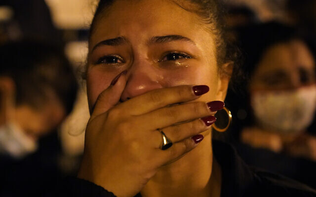Angelique McKenna reacts to President-elect Joe Biden's victory speech while listening at Black Lives Matter Plaza, Saturday, Nov. 7, 2020, in Washington. (AP Photo/Jacquelyn Martin) Angelique McKenna reacts to President-elect Joe Biden's victory speech while listening at Black Lives Matter Plaza, Saturday, Nov. 7, 2020, in Washington. (AP Photo/Jacquelyn Martin)