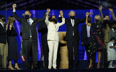 From left, Doug Emhoff, husband of Vice President-elect Kamala Harris, Harris, President-elect Joe Biden and his wife Jill Biden on stage together, Saturday, Nov. 7, 2020, in Wilmington, after Biden was declared the winner of the presidential election. (AP/Andrew Harnik)