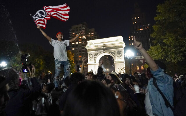 Revelers celebrate in Washington Square Park after former vice president and Democratic presidential candidate Joe Biden was announced as the winner over President Donald Trump to become the 46th president of the United States,, Saturday, Nov. 7, 2020, in New York. (AP Photo/Mary Altaffer) Revelers celebrate in Washington Square Park after former vice president and Democratic presidential candidate Joe Biden was announced as the winner over President Donald Trump to become the 46th president of the United States,, Saturday, Nov. 7, 2020, in New York. (AP Photo/Mary Altaffer)