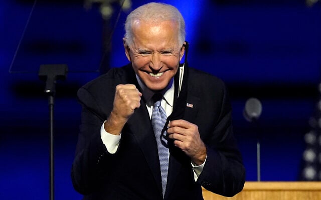 US President-elect Joe Biden gestures to supporters in Wilmington, Delaware, November 7, 2020. (Andrew Harnik/AP) US President-elect Joe Biden gestures to supporters in Wilmington, Delaware, November 7, 2020. (Andrew Harnik/AP)