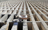 A cemetery worker prepares new graves at the Behesht-e-Zahra cemetery on the outskirts of the Iranian capital, Tehran, Iran, Nov. 1, 2020 (AP Photo/Ebrahim Noroozi)