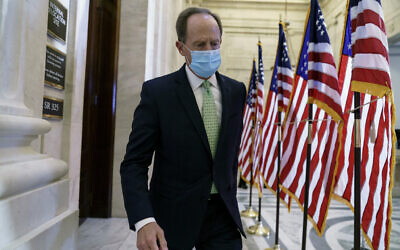 US Senator Pat Toomey departs after the Republican Conference held leadership elections, on Capitol Hill in Washington, November 10, 2020. (AP Photo/J. Scott Applewhite)