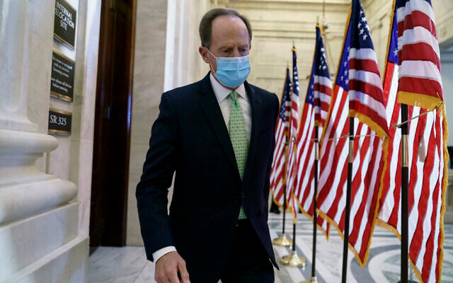 US Senator Pat Toomey departs after the Republican Conference held leadership elections, on Capitol Hill in Washington, November 10, 2020. (AP Photo/J. Scott Applewhite)