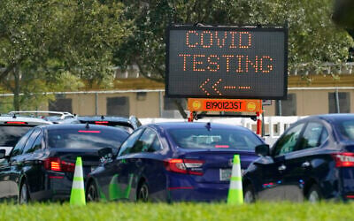 Cars line up at a COVID-19 testing site at Tropical Park, Saturday, Nov. 14, 2020, in Miami. (AP Photo/Wilfredo Lee) Cars line up at a COVID-19 testing site at Tropical Park, Saturday, Nov. 14, 2020, in Miami. (AP Photo/Wilfredo Lee)