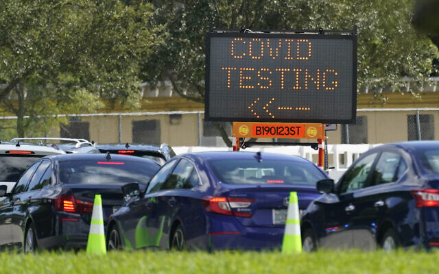 Cars line up at a COVID-19 testing site at Tropical Park, Saturday, Nov. 14, 2020, in Miami. (AP Photo/Wilfredo Lee) Cars line up at a COVID-19 testing site at Tropical Park, Saturday, Nov. 14, 2020, in Miami. (AP Photo/Wilfredo Lee)