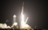 A SpaceX Falcon9 rocket, with the Crew Dragon capsule attached, lifts off from the Kennedy Space Center's Launch Complex 39-A, November 15, 2020, in Cape Canaveral, Florida. (AP Photo/John Raoux)