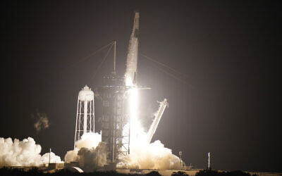 A SpaceX Falcon9 rocket, with the Crew Dragon capsule attached, lifts off from the Kennedy Space Center's Launch Complex 39-A, November 15, 2020, in Cape Canaveral, Florida. (AP Photo/John Raoux)