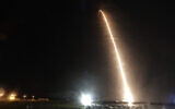 A Falcon 9 SpaceX rocket with the Crew Dragon capsule is seen during a time exposure as it lifts off from pad 39A at the Kennedy Space Center in Cape Canaveral, Fla., Sunday, Nov. 15, 2020. Four astronauts are beginning a mission to the International Space Station. (AP Photo/John Raoux)