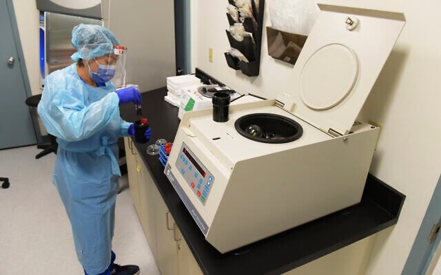 University of Miami Miller School of Medicine lab technician processing blood samples from study participants who volunteered to take part in testing the National Institutes of Health-funded Moderna COVID-19 vaccine in Miami, September 2, 2020. (AP Photo/Taimy Alvarez, File) University of Miami Miller School of Medicine lab technician processing blood samples from study participants who volunteered to take part in testing the National Institutes of Health-funded Moderna COVID-19 vaccine in Miami, September 2, 2020. (AP Photo/Taimy Alvarez, File)