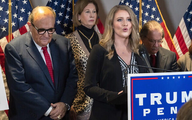 Members of US President Donald Trump's legal team, including former Mayor of New York Rudy Giuliani, left, Sidney Powell, and Jenna Ellis, speaking, attend a news conference at the Republican National Committee headquarters on November 19, 2020, in Washington. (AP/Jacquelyn Martin) Members of US President Donald Trump's legal team, including former Mayor of New York Rudy Giuliani, left, Sidney Powell, and Jenna Ellis, speaking, attend a news conference at the Republican National Committee headquarters on November 19, 2020, in Washington. (AP/Jacquelyn Martin)