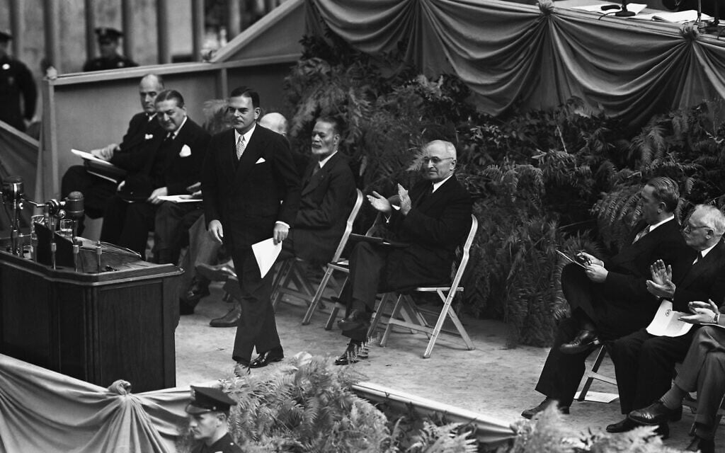 President Harry Truman (right), begins applause as New York Gov. Thomas E. Dewey strides to the speakers' platform during cornerstone laying ceremonies for the permanent headquarters of the United Nations on October 24, 1949 in New York City. (AP Photo)