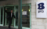 A man walks out from a building of Bezeq Israeli Telecommunication Corp. January 25, 2011. (Kobi Gideon/Flash90)