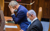 Defense Minister Benny Gantz, left, and Prime Minister Benjamin Netanyahu seen during a vote at the Knesset, in Jerusalem on August 24, 2020. (Oren Ben Hakoon/Flash90)
