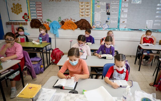 Illustrative: Students wear masks in a classroom in the Jewish settlement of Efrat, in the West Bank, on November 1, 2020 (Gershon Elinson/Flash90) Illustrative: Students wear masks in a classroom in the Jewish settlement of Efrat, in the West Bank, on November 1, 2020 (Gershon Elinson/Flash90)
