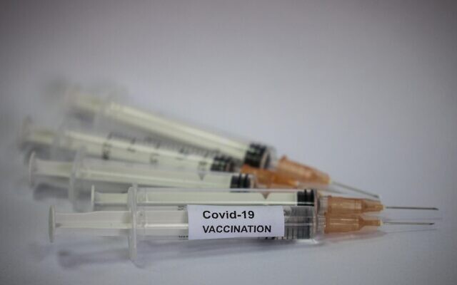 Illustrative: Syringes labeled as containing COVID-19 vaccinations in Jerusalem, November 16, 2020. (Yonatan Sindel/Flash90) Illustrative: Syringes labeled as containing COVID-19 vaccinations in Jerusalem, November 16, 2020. (Yonatan Sindel/Flash90)