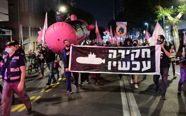 Israelis march during a protest against Prime Minister Benjamin Netanyahu in Tel Aviv on November 19, 2020. (Tomer Neuberg/Flash90) Israelis march during a protest against Prime Minister Benjamin Netanyahu in Tel Aviv on November 19, 2020. (Tomer Neuberg/Flash90)