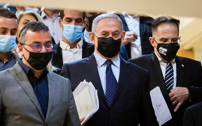 Prime Minister Benjamin Netanyahu (C) at the Knesset on November 10, 2020. (Oren Ben Hakoon/Pool/Flash90)
