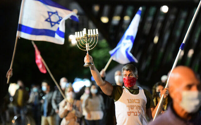 People protest against Prime Minister Benjamin Netanyahu at Rabin Square in Tel Aviv on November 21, 2020 (Avshalom Sassoni/Flash90) People protest against Prime Minister Benjamin Netanyahu at Rabin Square in Tel Aviv on November 21, 2020 (Avshalom Sassoni/Flash90)