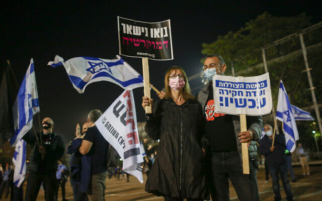 People protest against Prime Minister Benjamin Netanyahu at Rabin Square in Tel Aviv, on November 28, 2020. (Miriam Alster/Flash90) People protest against Prime Minister Benjamin Netanyahu at Rabin Square in Tel Aviv, on November 28, 2020. (Miriam Alster/Flash90)