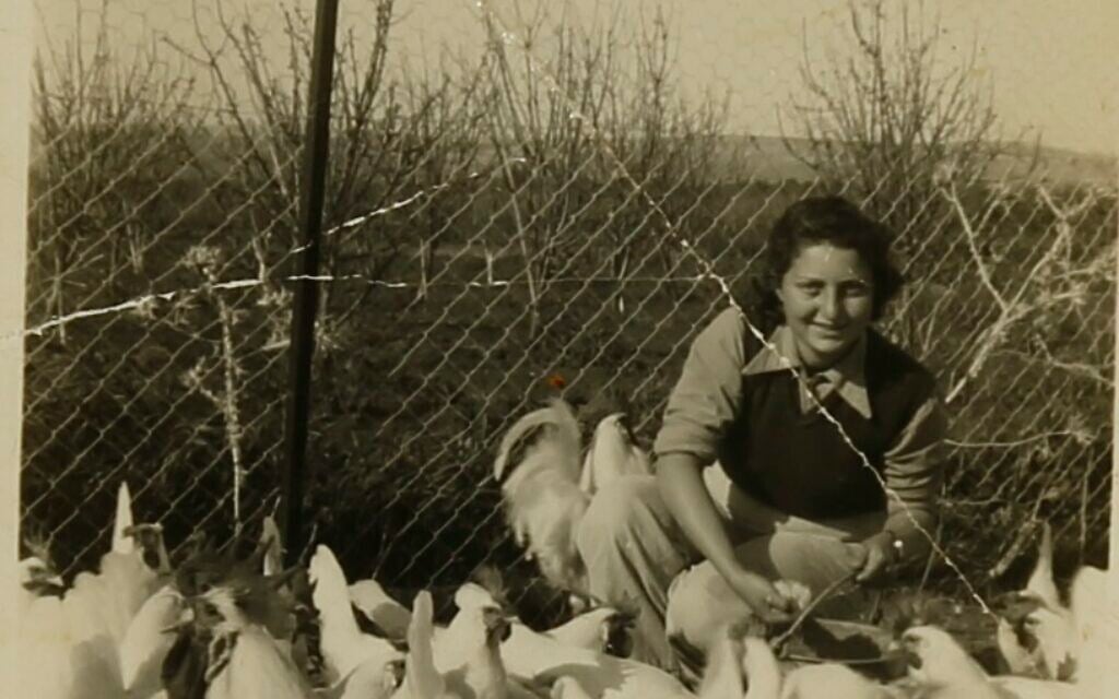 Hannah Senesh with chickens on Moshav Nahalal, part of the Hannah Senesh Collection that is now part of Israel's National Library (Courtesy National Library of Israel)