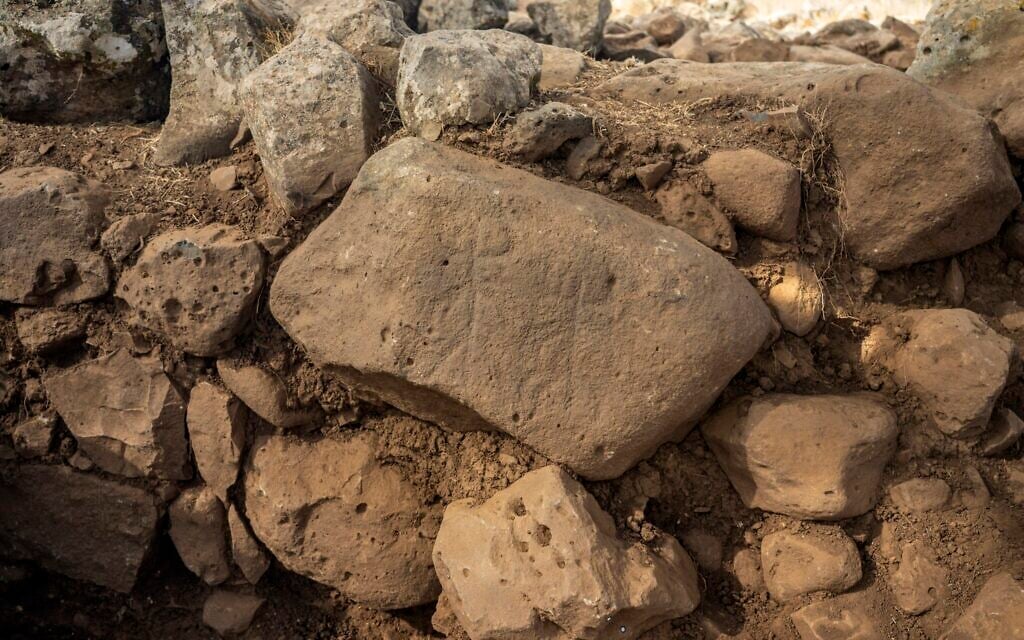 The engraved stone discovered in the excavation at Hispin in the Golan, which dates to circa 11th century BCE, and could be the earliest evidence of the biblical 'Geshurites.' (Yaniv Berman, Israel Antiquities Authority)
