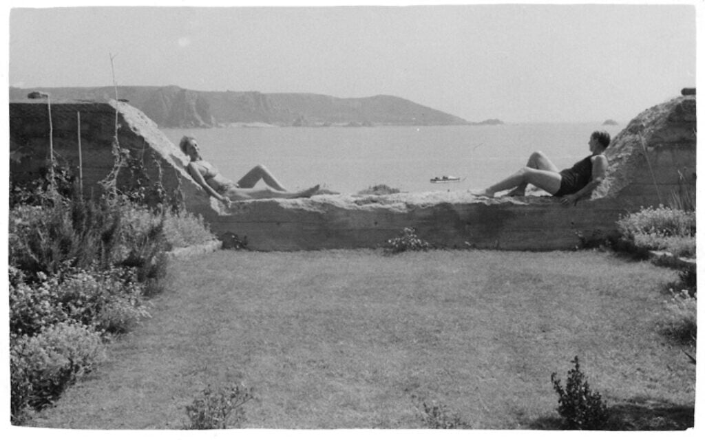 Lucy and Suzanne reclining at the water near their home in Jersey. (Jersey Heritage Collections/ via New York Jewish Week)