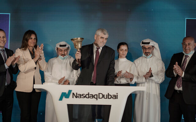 Bank Hapoalim delegation of Israeli businesspeople, led by Dov Kokler, rings the bell to begin the day's trading at the NASDAQ Dubai exchange in Sept. 2020. The delegation was welcomed by the exchange's president, Hamed Ali, and the president and the CEO of the Dubai stock exchange, Hassan Abdul Rahaman Alserka (Courtesy) Bank Hapoalim delegation of Israeli businesspeople, led by Dov Kokler, rings the bell to begin the day's trading at the NASDAQ Dubai exchange in Sept. 2020. The delegation was welcomed by the exchange's president, Hamed Ali, and the president and the CEO of the Dubai stock exchange, Hassan Abdul Rahaman Alserka (Courtesy)