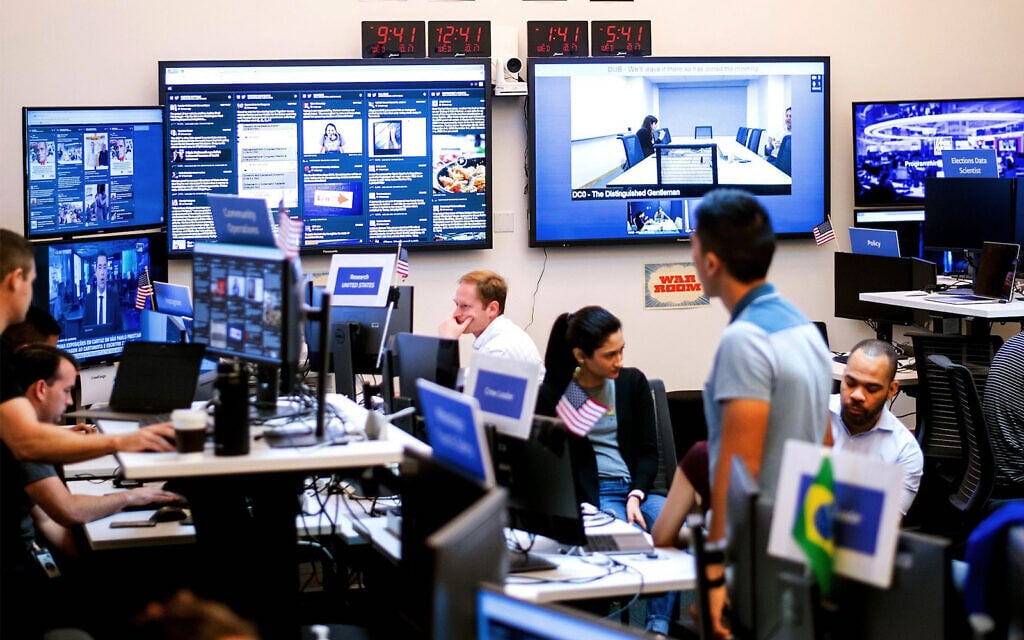 Facebook employees work in a unit focused on the fight against misinformation and manipulation in Menlo Park, California, in 2018. (Noah Berger/AFP via Getty Images) Facebook employees work in a unit focused on the fight against misinformation and manipulation in Menlo Park, California, in 2018. (Noah Berger/AFP via Getty Images)