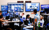 Facebook employees work in a unit focused on the fight against misinformation and manipulation in Menlo Park, California, in 2018. (Noah Berger/AFP via Getty Images)
