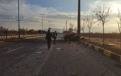 A photo released by Iran's semi-official Fars News Agency shows the scene where Mohsen Fakhrizadeh was killed in Absard, a small city just east of the capital, Tehran, Iran, Nov. 27, 2020. (Fars News Agency via AP)