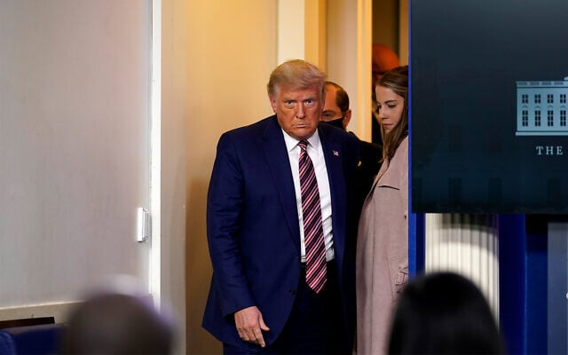 US President Donald Trump arrives to speak at a news conference in the briefing room at the White House in Washington, Nov. 20, 2020. (AP Photo/Susan Walsh) US President Donald Trump arrives to speak at a news conference in the briefing room at the White House in Washington, Nov. 20, 2020. (AP Photo/Susan Walsh)