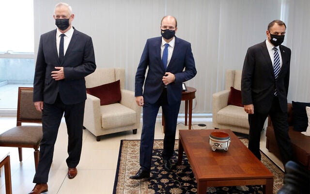 Defense Minister Benny Gantz, left, Cyprus Defense Minister Charalambos Petrides, center, and Greek Defense Minister Nikolaos Panagiotopoulos, right, ahead of a meeting in the Cypriot capital Nicosia, Nov. 12, 2020. (AP Photo/Petros Karadjias) Defense Minister Benny Gantz, left, Cyprus Defense Minister Charalambos Petrides, center, and Greek Defense Minister Nikolaos Panagiotopoulos, right, ahead of a meeting in the Cypriot capital Nicosia, Nov. 12, 2020. (AP Photo/Petros Karadjias)