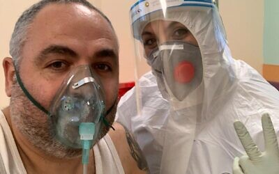 Shlomi Tova with a nurse in a coronavirus ward at Galilee Medical Center (Shlomi Tova)