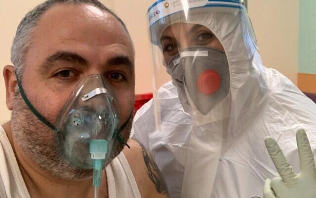 Shlomi Tova with a nurse in a coronavirus ward at Galilee Medical Center (Shlomi Tova)