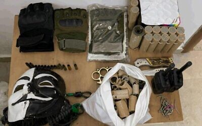 Weapons and other contraband that was found in the possession of a Palestinian teenager suspected of working on behalf of the Hamas terror group in a photograph released by the Shin Bet security service on November 9, 2020.