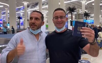 An Israeli tourist shows his passport after he lands in Dubai on the inaugural commercial Flydubai flight from Ben Gurion Airport to Dubai, November 26, 2020 (Screen grab/Channel 12)