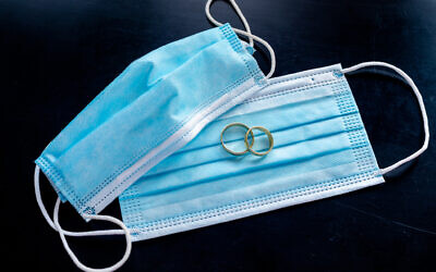 Illustrative image: Wedding rings with facemasks (iStock)