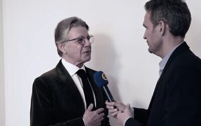 Geoffrey Hoguet (L), a descendent of the Rothschild family, is interviewed on February 25, 2020 (Screen grab/YouTube)