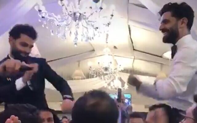 Egypt and Liverpool's Mohamed Salah dances with his brother at his Cairo wedding, days before he announced he had contracted the coronavirus (Screen grab/Tiktok user Abdallah.ali22) Egypt and Liverpool's Mohamed Salah dances with his brother at his Cairo wedding, days before he announced he had contracted the coronavirus (Screen grab/Tiktok user Abdallah.ali22)