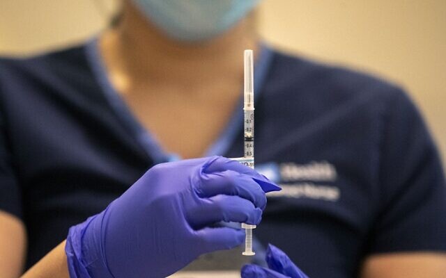 Illustrative: A nurse prepares to give an injection of the COVID-19 vaccine to a healthcare worker at Ronald Reagan UCLA Medical Center in Westwood, California on December 16, 2020. (Brian van der Brug/Pool/AFP) Illustrative: A nurse prepares to give an injection of the COVID-19 vaccine to a healthcare worker at Ronald Reagan UCLA Medical Center in Westwood, California on December 16, 2020. (Brian van der Brug/Pool/AFP)