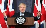 Britain's Prime Minister Boris Johnson gestures as he holds a remote press conference to update the nation on the post-Brexit trade agreement, inside 10 Downing Street in central London on December 24, 2020. (Paul GROVER / POOL / AFP)