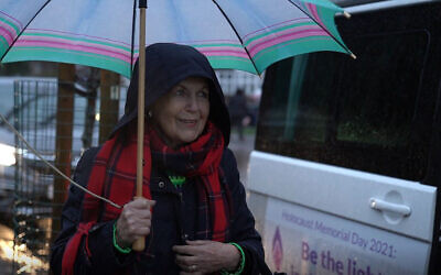 Holocaust survivor Mala Tribich stands outside the Learning from the Righteous mobile studio in London, UK in December 2020. (Learning from the Righteous/ via JTA)