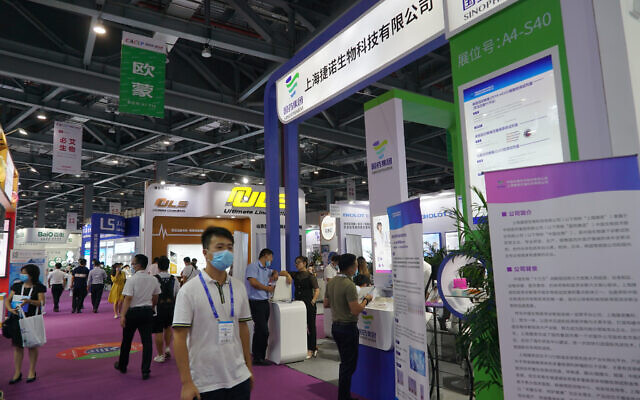 Shanghai-based testing kit company GeneoDx presents a booth at a trade fair in Nanchang in eastern China's Jiangxi province on Saturday, Aug. 22, 2020. (AP Photo/Dake Kang) Shanghai-based testing kit company GeneoDx presents a booth at a trade fair in Nanchang in eastern China's Jiangxi province on Saturday, Aug. 22, 2020. (AP Photo/Dake Kang)