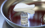 A vial with Russia's Sputnik V coronavirus vaccine in a medical room, in Moscow, Russia, December 5, 2020 (Pavel Golovkin/AP)