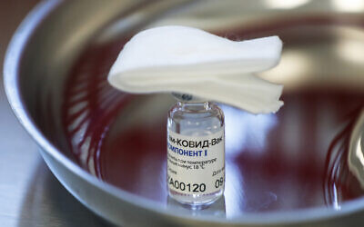 A vial with Russia's Sputnik V coronavirus vaccine in a medical room, in Moscow, Russia, December 5, 2020 (Pavel Golovkin/AP)