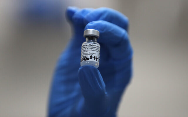 A nurse holds a vial of the Pfizer-BioNTech COVID-19 vaccine at Guy's Hospital in London, December 8, 2020. (AP Photo/Frank Augstein, Pool) A nurse holds a vial of the Pfizer-BioNTech COVID-19 vaccine at Guy's Hospital in London, December 8, 2020. (AP Photo/Frank Augstein, Pool)