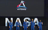 Five of the astronauts that will be part of the Atremis missions, from left, Jessica Meir, Joe Acaba, Anne McClain, Matthew Dominick, and Jessica Watkins are introduced by Vice President Mike Pence during the eighth meeting of the National Space Council at the Kennedy Space Center Wednesday, Dec. 9, 2020, in Cape Canaveral , Fla. (AP Photo/John Raoux)